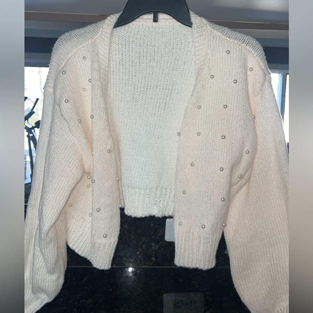 cream-colored, pearl cardigan